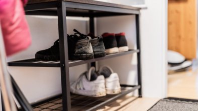 Shoe storage in the staircase.