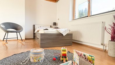 Play area with a single bed and rocking chair., © Kathrin Huber