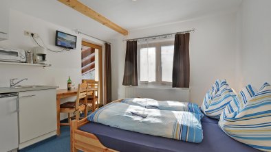 Appartement Kitzbüheler Horn Wohnküche und Schlafz