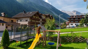 Playground with trampoline in Summer