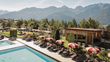 Outdoor pools and garden with mountain view