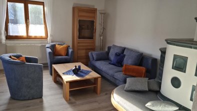 Living Area with Tiled Stove, © Haus Tholler