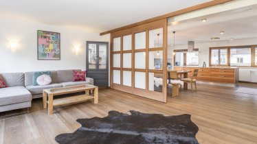 living room with sliding door to the dining room.