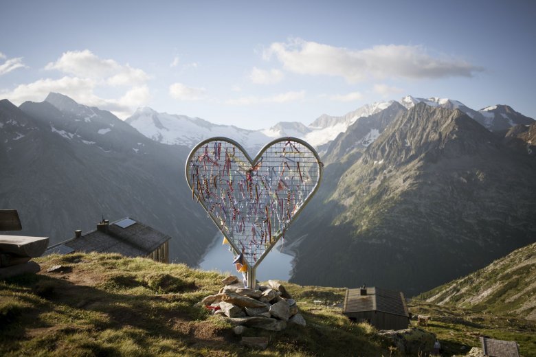 Olperer Hut in Zillertal Valley offers incredible views of mountain peaks and a glinting lake
