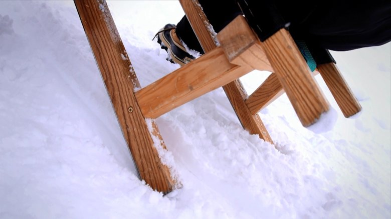 To brake, press both feet into the snow next to the skids.