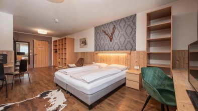 Hotelzimmer mit gemütliche Doppelbetten