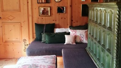 Lounge room with built-in table and chairs, couch and T.V