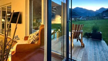 Window front with a view of the garden and mountain panorama