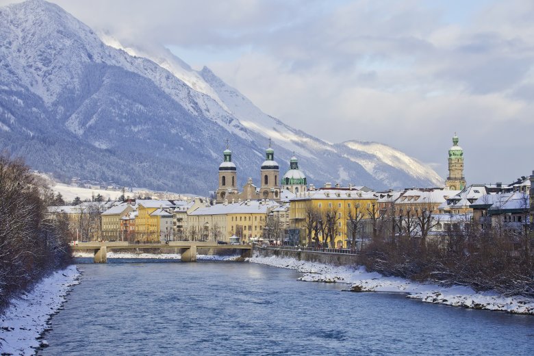 View of Inn River Bridge at the gateway to Innsbruck’s historic old town.