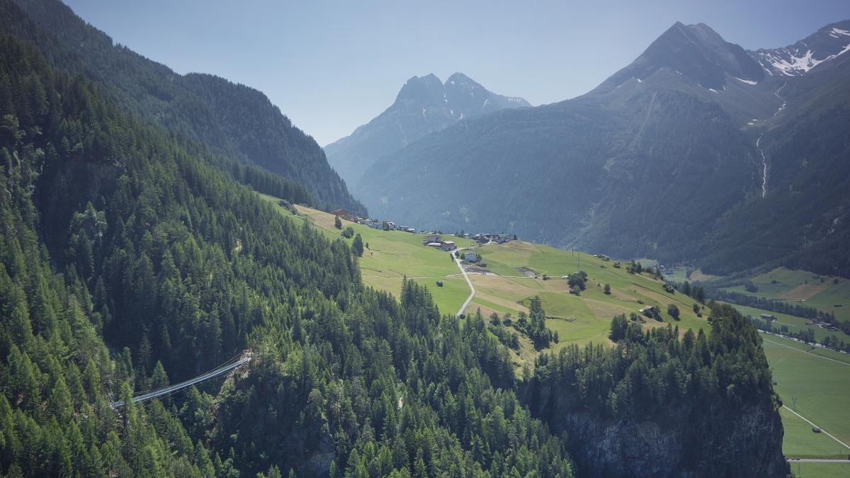 This 83m long and 220m hanging bridge connects Brand with Burgstein and even offers a special walkway for dogs., © Ötztal Tourismus/Lukas Ennemoser