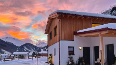 Lodge immersed in a winter evening atmosphere