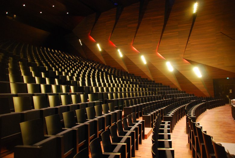 For superb acoustics, the Concert Hall is covered with stained acacia wood. Photo Credit: Tom Benz