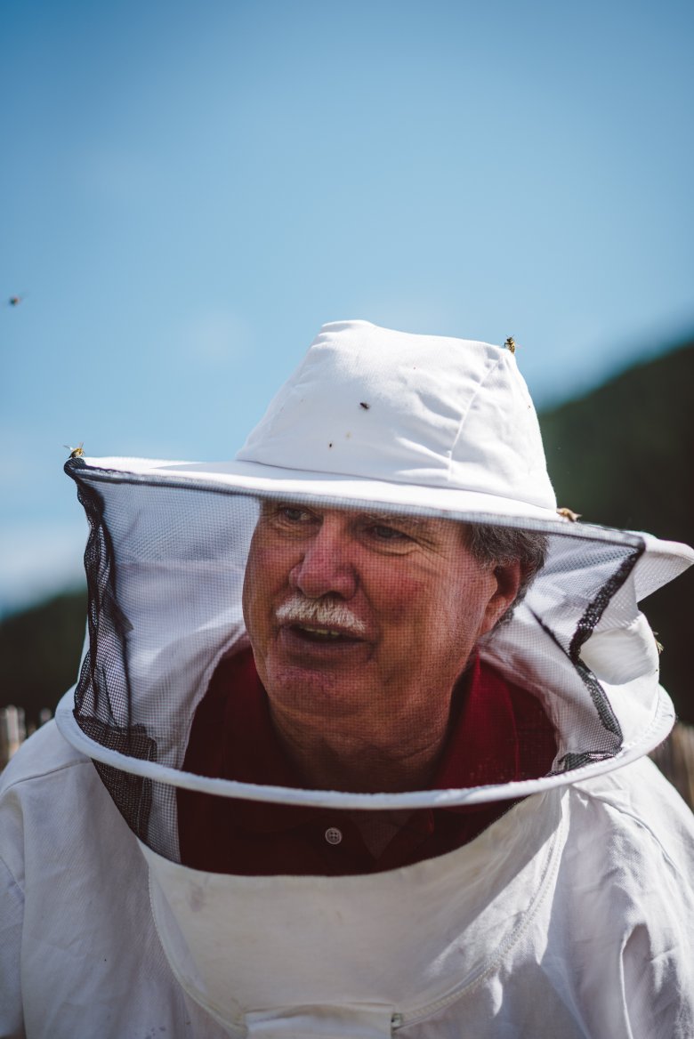 Reinhard Hetzenauer with his protective beekeeper&rsquo;s hat. His grandfather originally sparked his interest in beekeeping.
