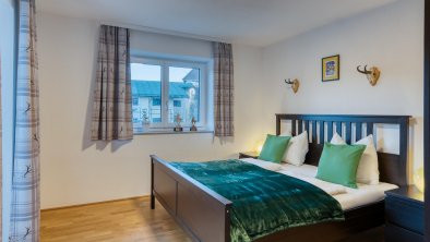 Apartment Wilder Kaiser Bett im Schlafzimmer