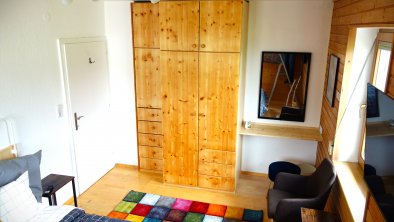 Master bedroom with double bed and wardrobe.