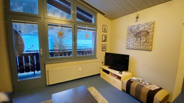 LOUNGE AREA with doors to balcony